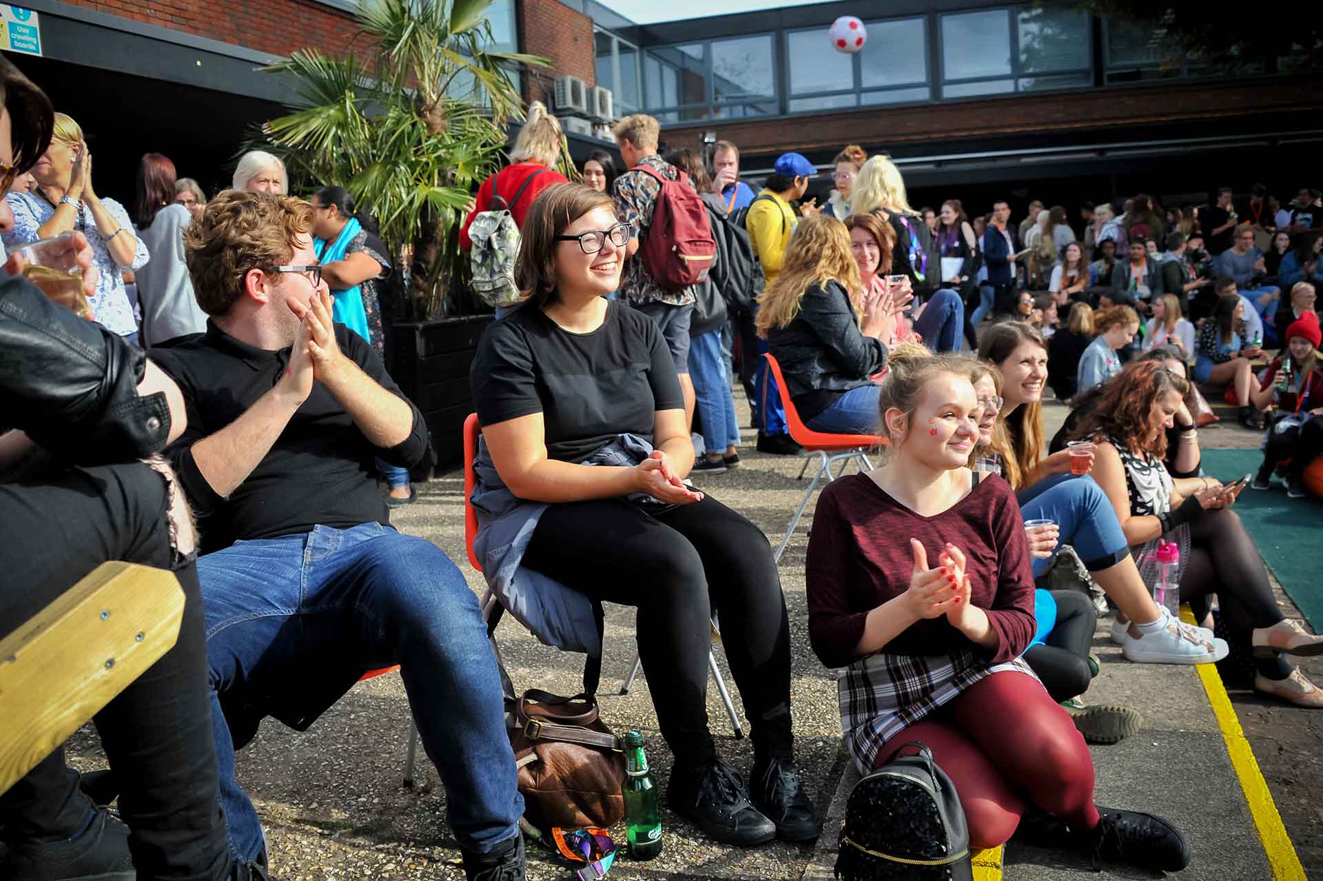 Students laughing at Farnham Freshers Fair